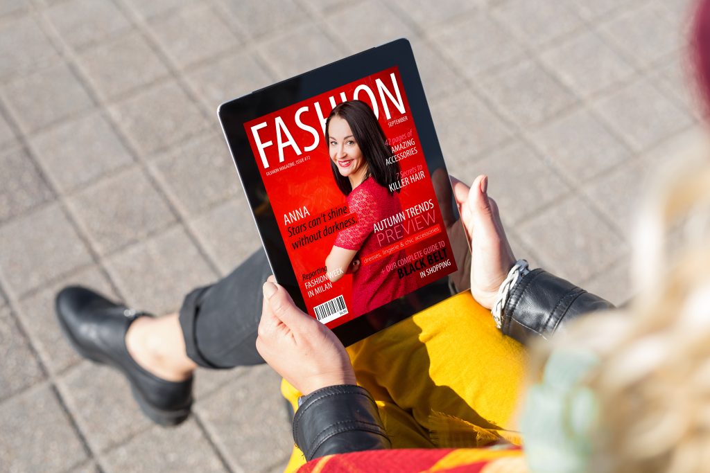Woman,Reading,Fashion,Magazine,On,Tablet