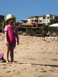 Izzy at the beach in Cabo, a favorite vacation spot