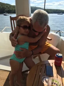 John’s daughter Izzy giving her grandfather a hug